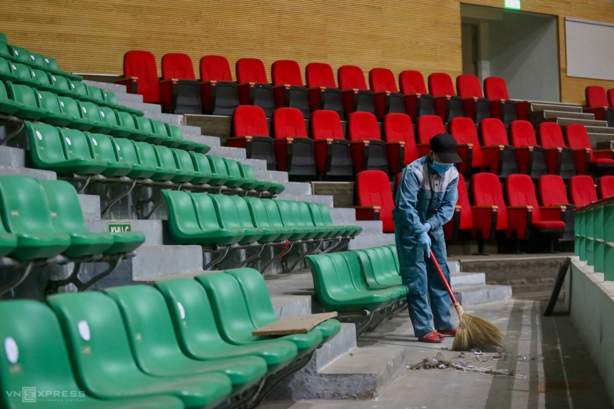 A worker cleans up the audience area. The area would be used as a resting place for medical personnel and patients family members.