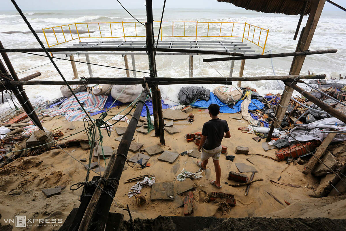 A section of the wall made of stone, brick, and cement was knocked down by the waves while the upper part was broken in two. To avoid inward erosion, business owners used hundreds of sandbags to reinforce them.
