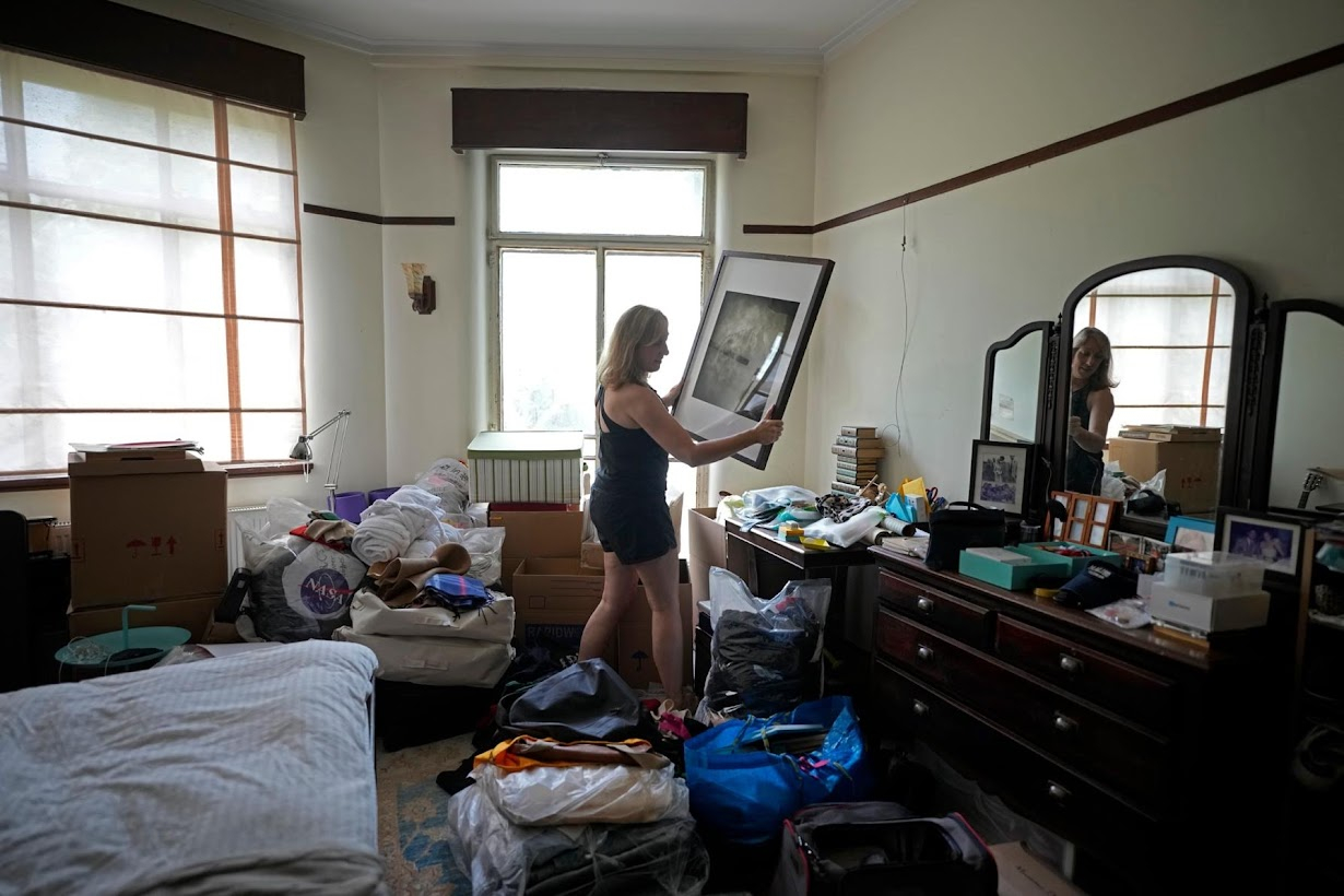 Heather packs her belongings before leaving China for the U.S. Photo by Aly Song